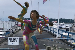 Photo of several digital characters dancing at the Nanaimo Waterfront
